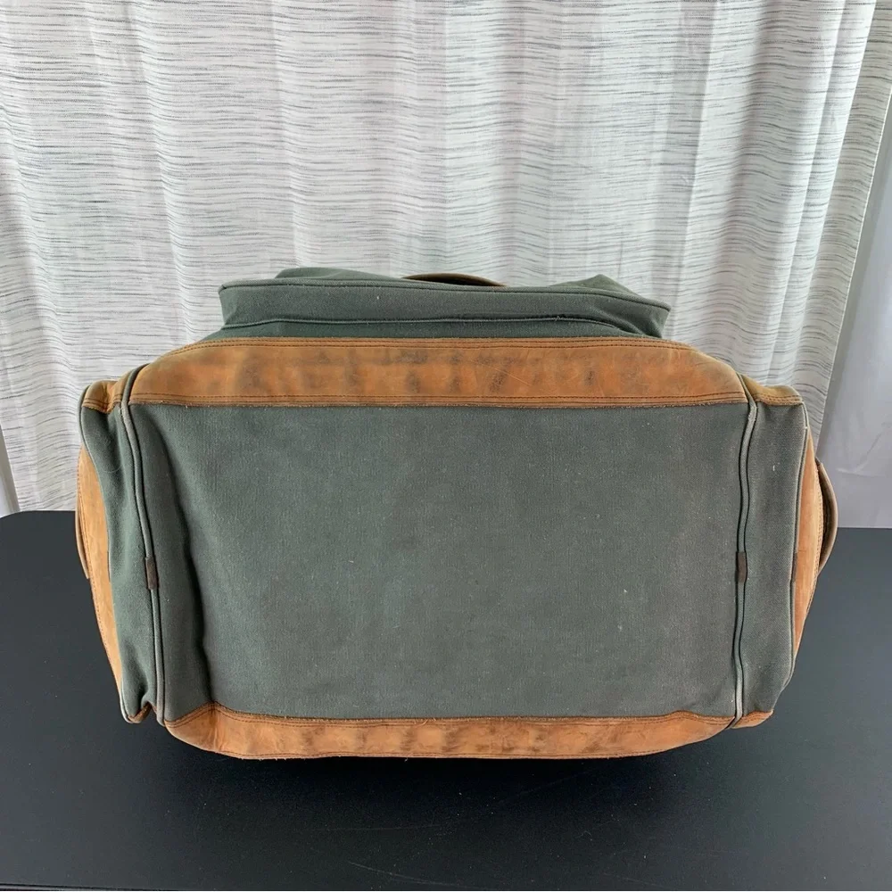 High Sierra Green canvas and Brown leather Duffel Bag.
